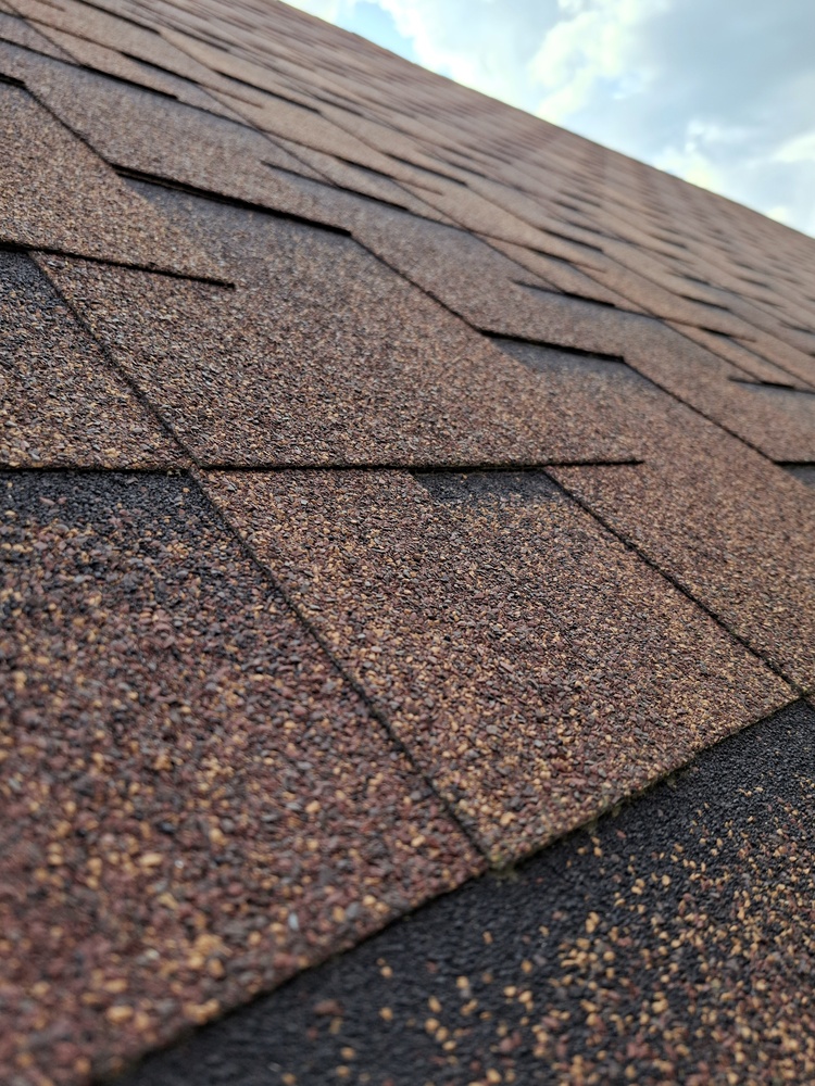 Bituminous,Shingles,On,Sloped,Private,House,Roof